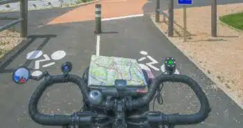a bicycle with a map on the handlebars